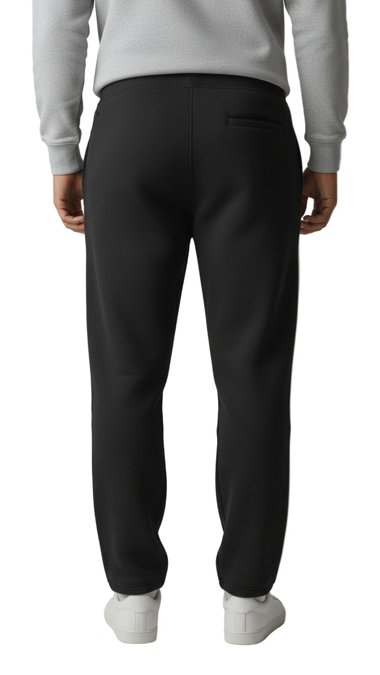 Person wearing black pants and a gray sweatshirt on a plain background