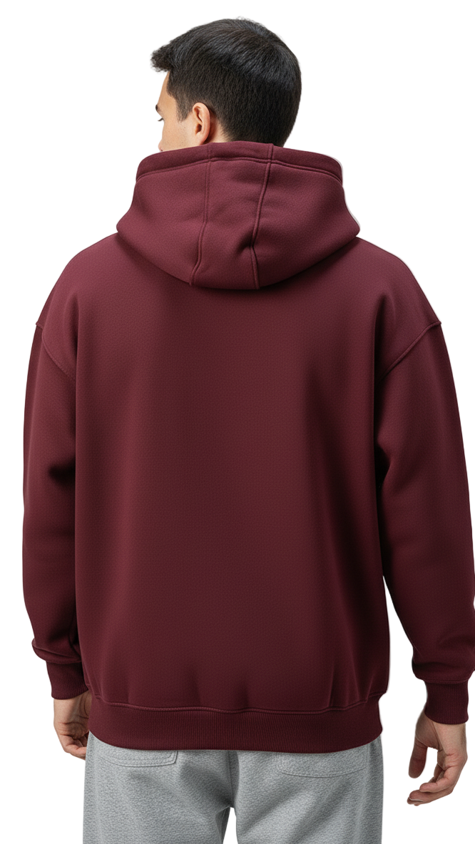 Person wearing a maroon hoodie on a plain background