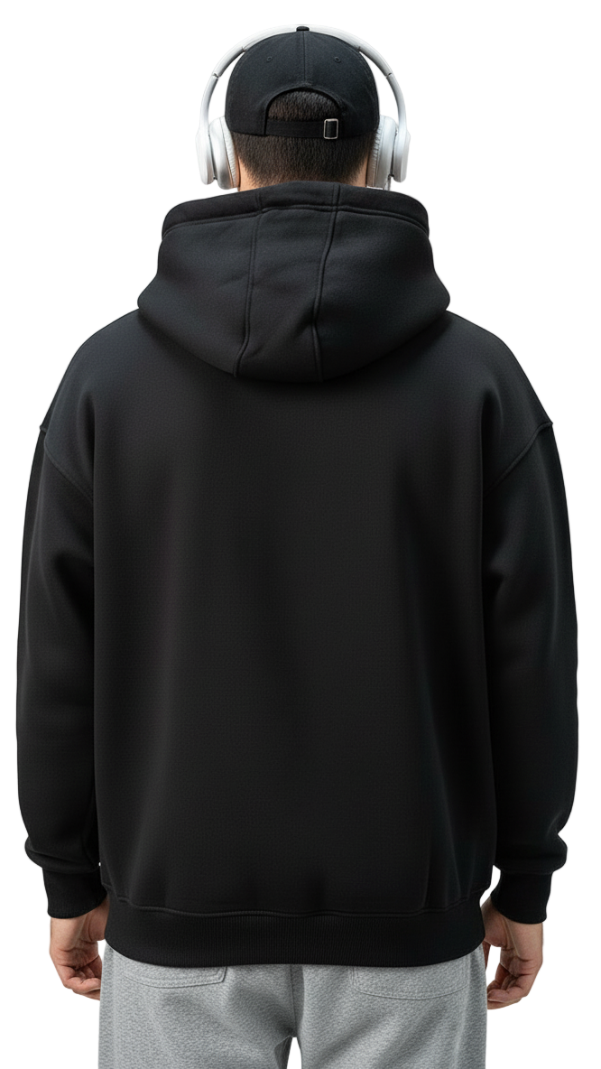 Person wearing a black hoodie and gray pants against a plain background