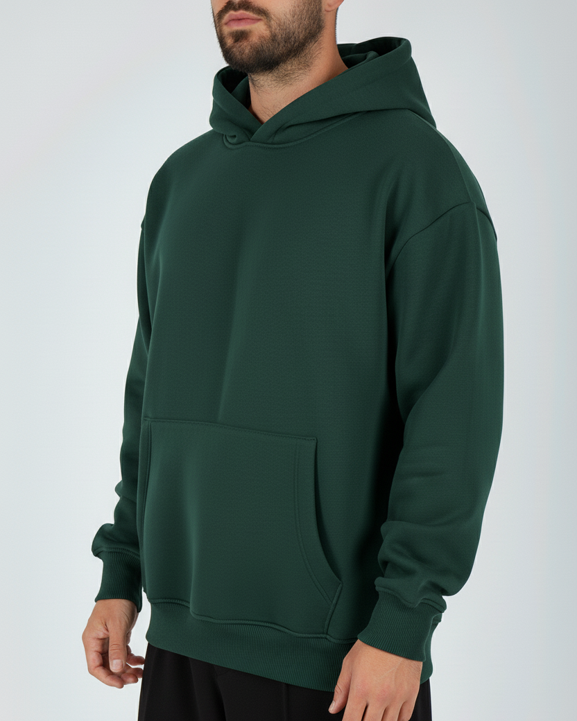 Person wearing a green hoodie on a white background