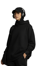 Person wearing a black outfit with headphones on a white background