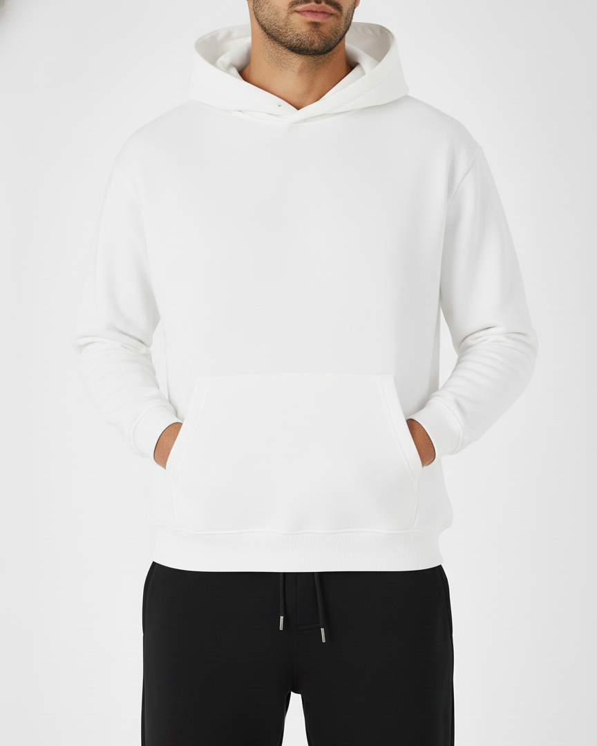 Person wearing a white hoodie and black pants on a white background