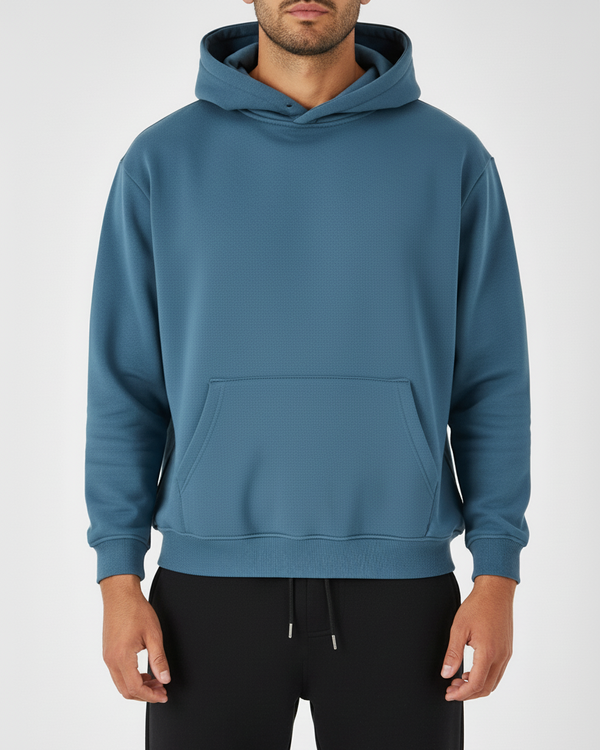 Blue hoodie worn by a person on a white background