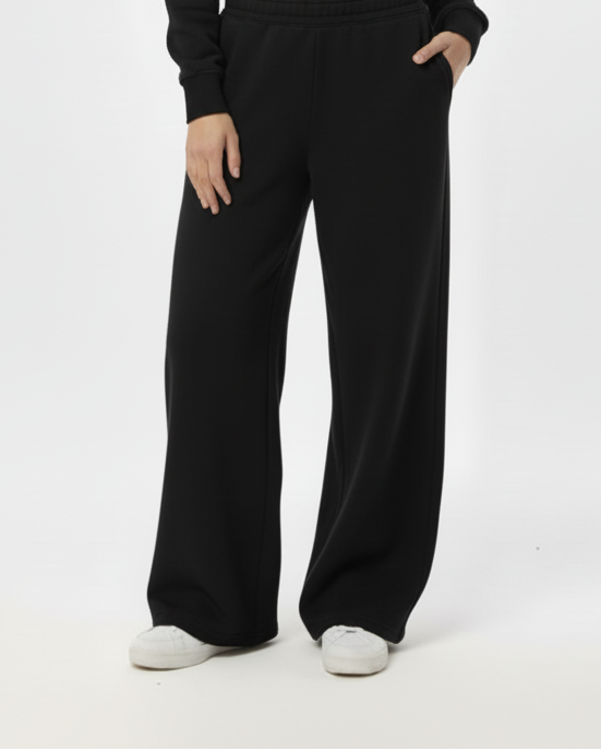 Woman wearing a black outfit on a white background