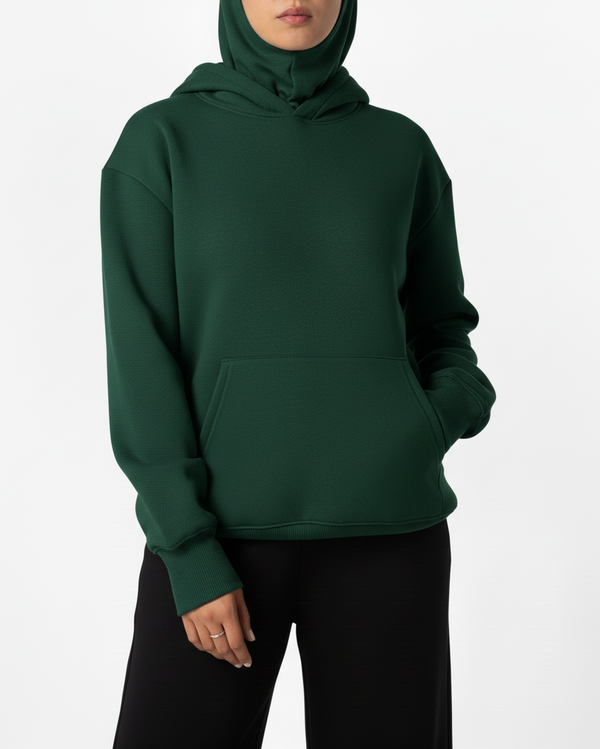 Green hoodie worn by a person on a white background