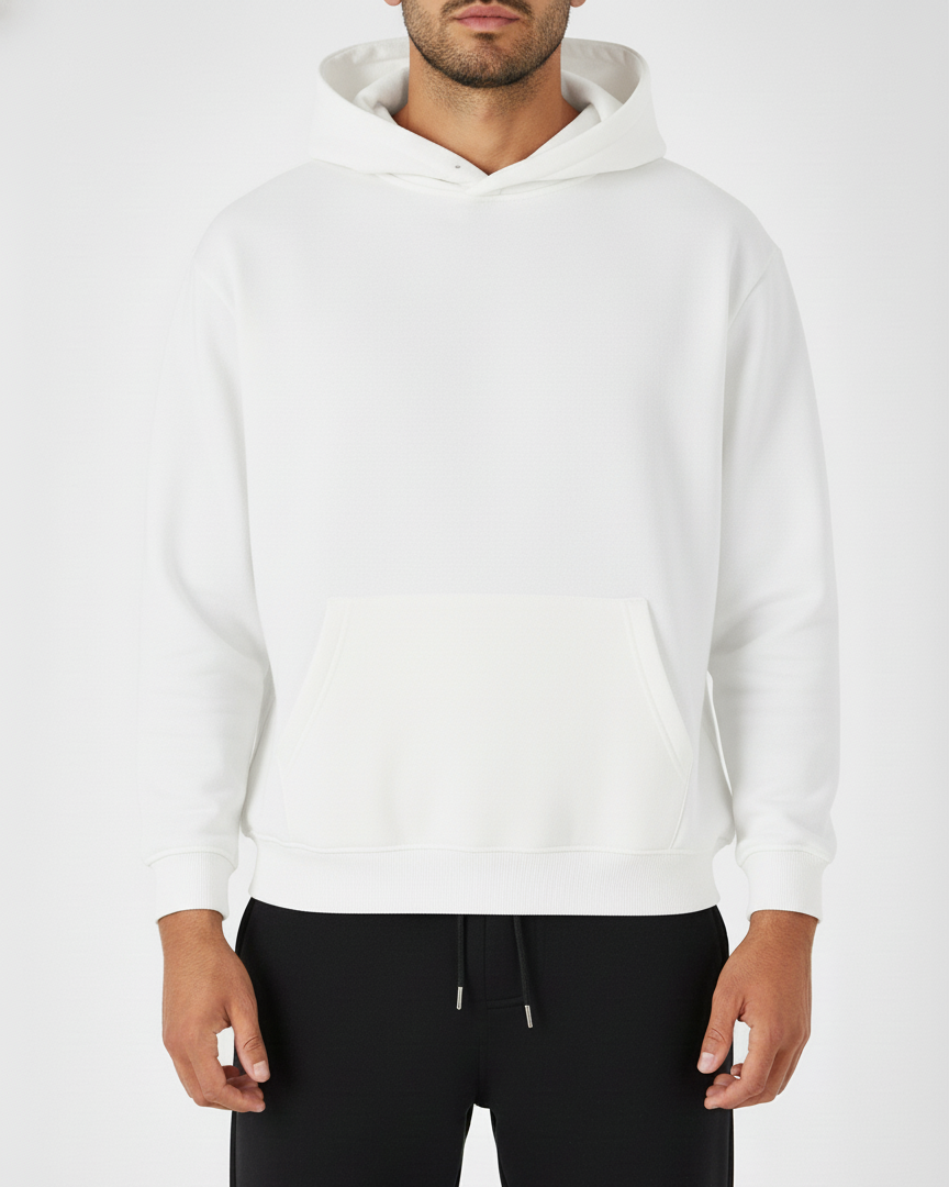 Person wearing a white hoodie and black pants on a white background