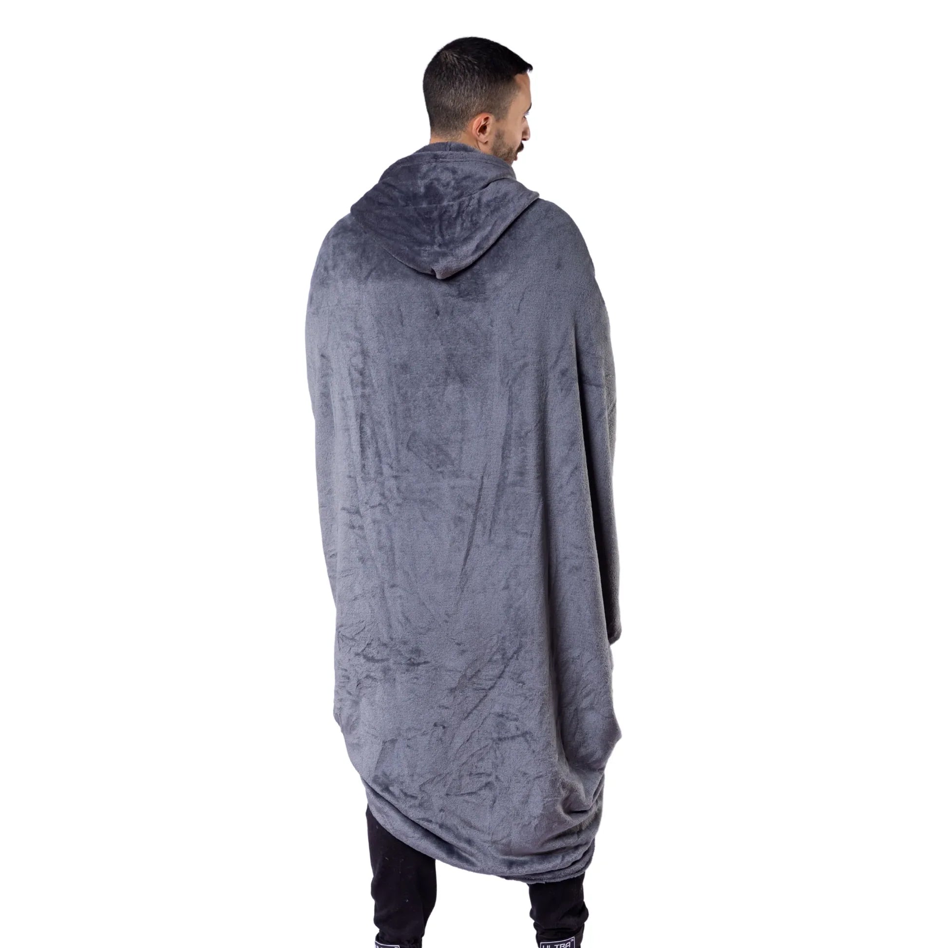 Person wearing a long gray hoodie on a white background